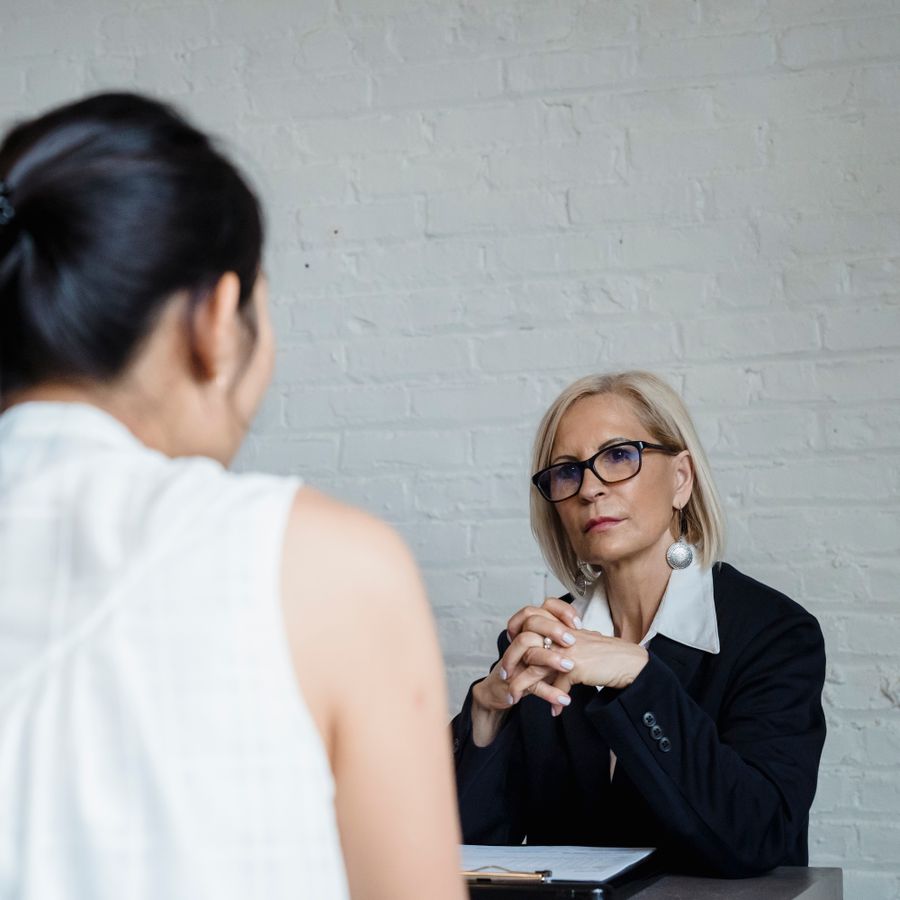 A mentor and colleague in a one-on-one coaching conversation