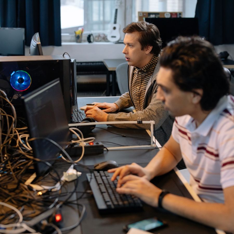 Software developers building at their workstations