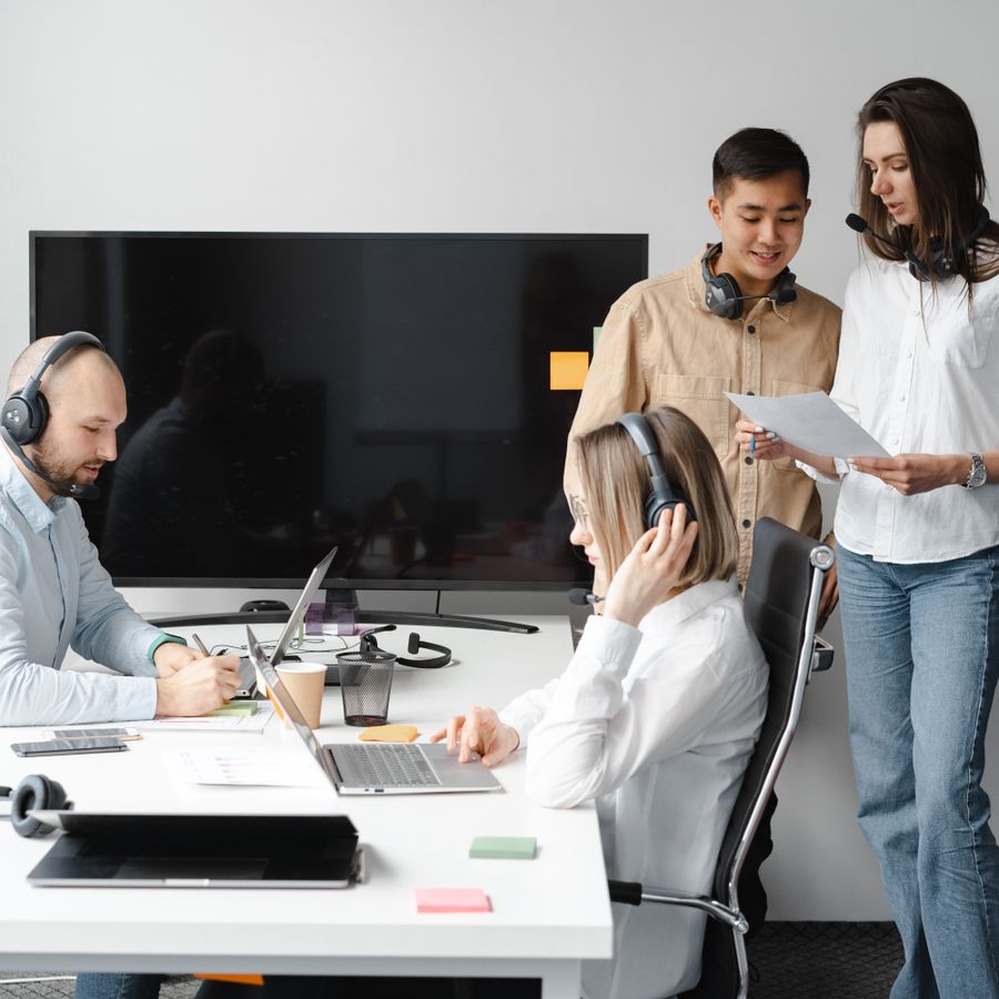 An operations team monitoring work at their stations